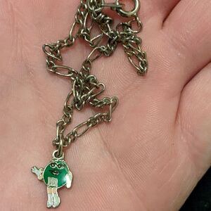 Silver 8" chain with a mars green Eminem girl charm